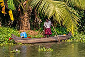 Kerala backwaters, our three hours neighborhood tour in the narrow canoe towards Vembanad Lake and along one of the  narrow canal running near our guest house at Kumarakom. 